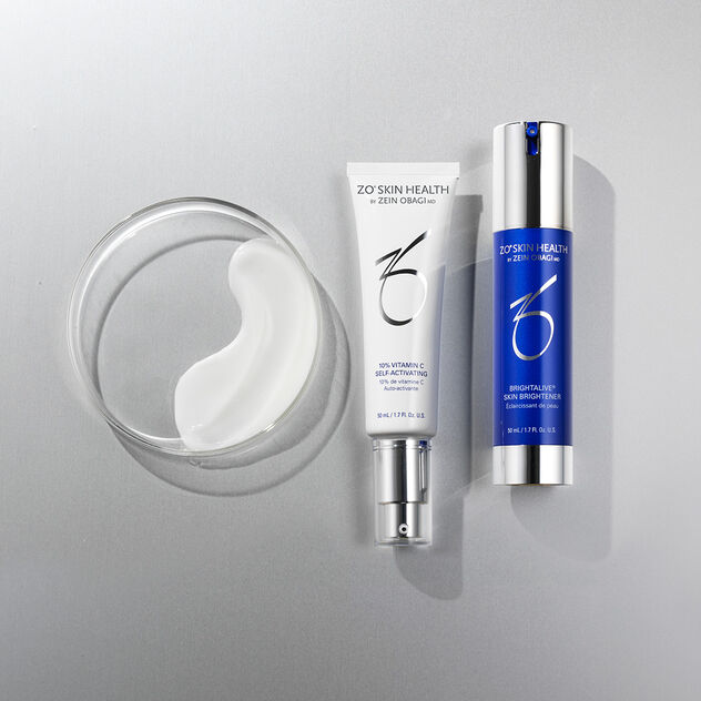 Broad-Spectrum Sunscreen, Rozatrol Accelerated Serum, Balancing Cleansing Emulsion, Hydrating Creme, Sunscreen + Powder and Sunscreen + Primer on grey/silver background